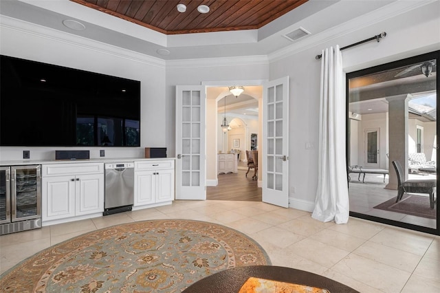 bar with wood ceiling, wine cooler, white cabinets, french doors, and a raised ceiling