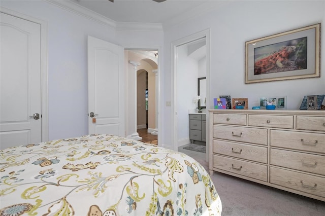 bedroom featuring light carpet and ornamental molding