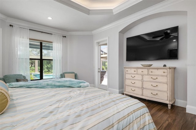 bedroom featuring dark wood-type flooring, ornamental molding, and access to exterior