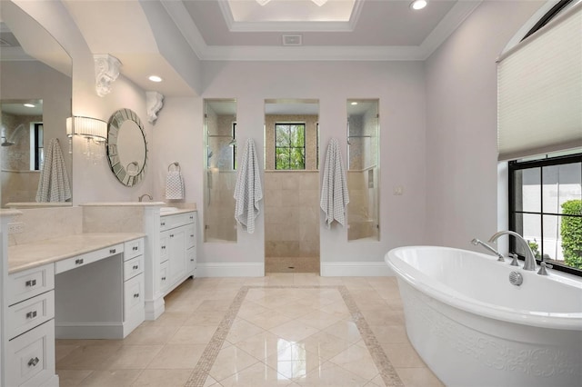 bathroom featuring a tray ceiling, vanity, crown molding, and shower with separate bathtub