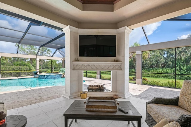 view of pool with a lanai, a patio, and an in ground hot tub