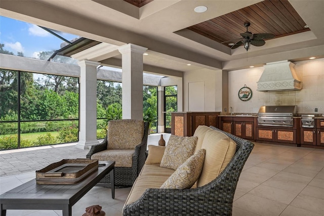 view of patio with a grill, sink, ceiling fan, and an outdoor kitchen