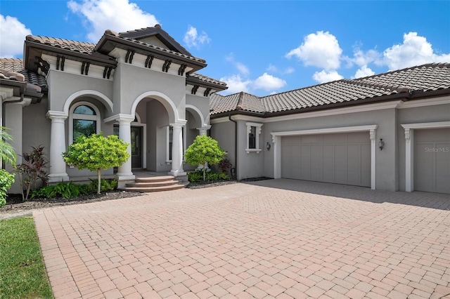 mediterranean / spanish-style home featuring a garage