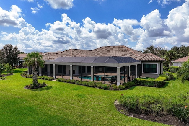 back of property featuring a lanai, a patio area, and a lawn