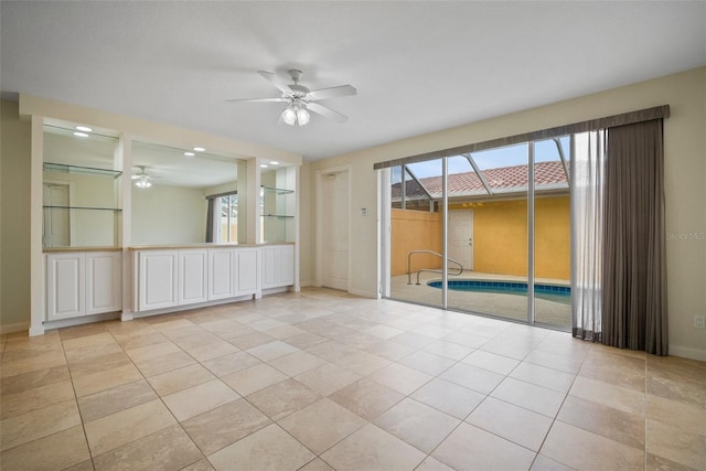 tiled empty room with ceiling fan