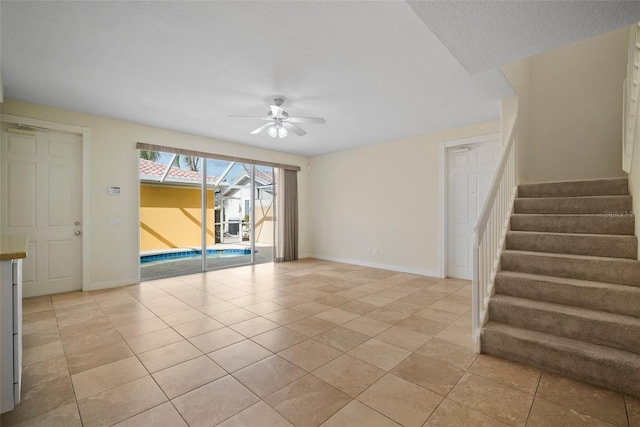 interior space featuring ceiling fan and light tile patterned floors