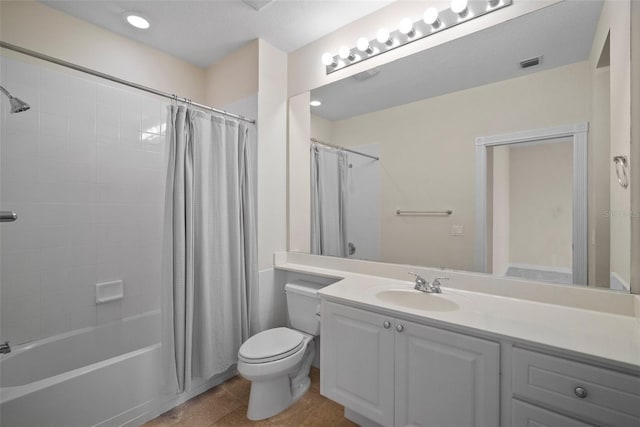 full bathroom with vanity, shower / bath combo, tile patterned floors, and toilet