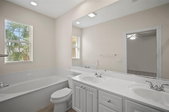 bathroom with a tub to relax in, vanity, toilet, and tile patterned flooring