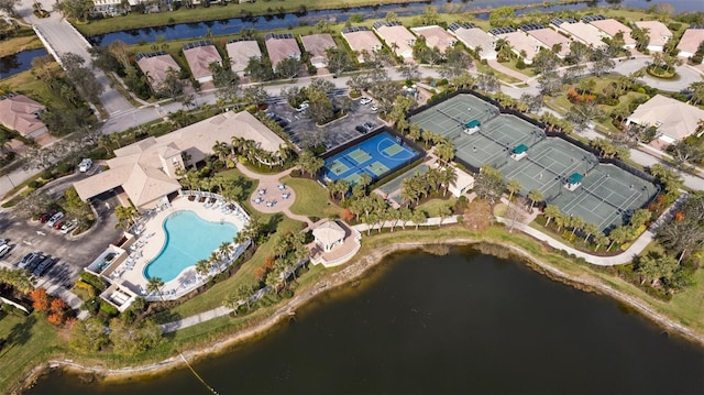 birds eye view of property with a water view