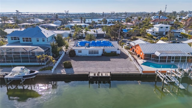 aerial view with a water view and a residential view