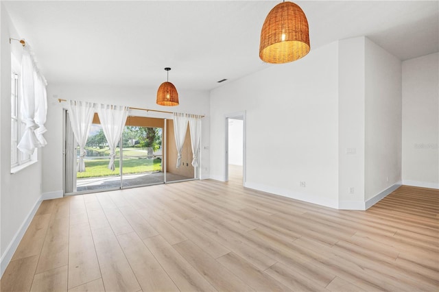 unfurnished living room with light wood-type flooring