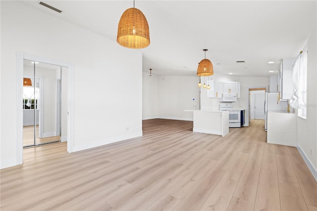 unfurnished living room with light hardwood / wood-style flooring