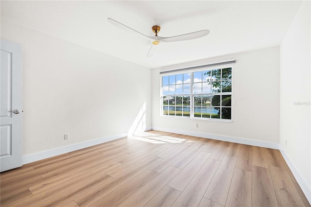 empty room featuring light hardwood / wood-style flooring and ceiling fan