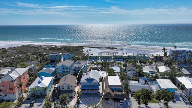 bird's eye view with a water view and a view of the beach