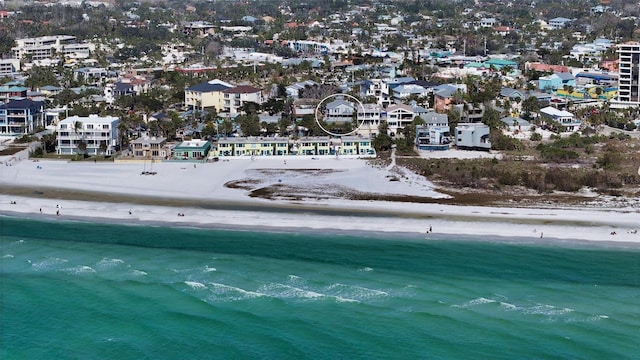 birds eye view of property featuring a view of the beach and a water view