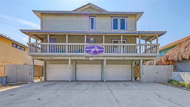 view of front of home featuring a garage and a balcony