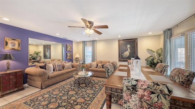 living room with ceiling fan and light tile patterned floors