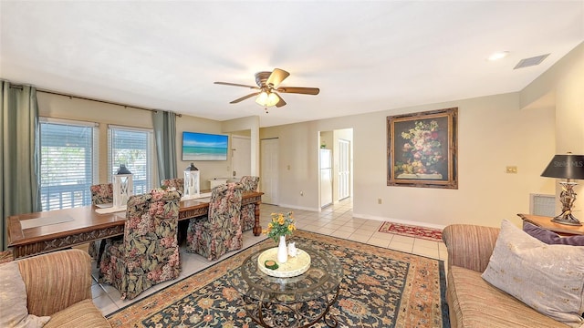 interior space featuring light tile patterned floors and ceiling fan