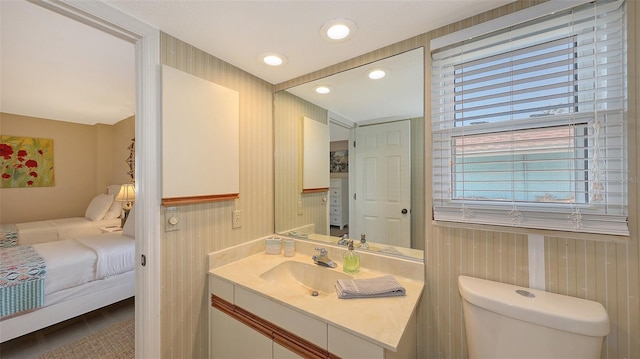 bathroom with vanity and toilet