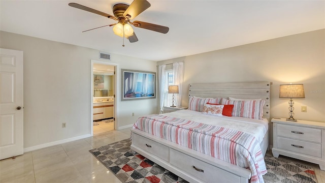 bedroom featuring light tile patterned floors, ensuite bath, and ceiling fan