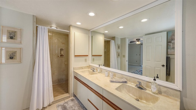 bathroom featuring walk in shower, ceiling fan, vanity, and tile patterned floors