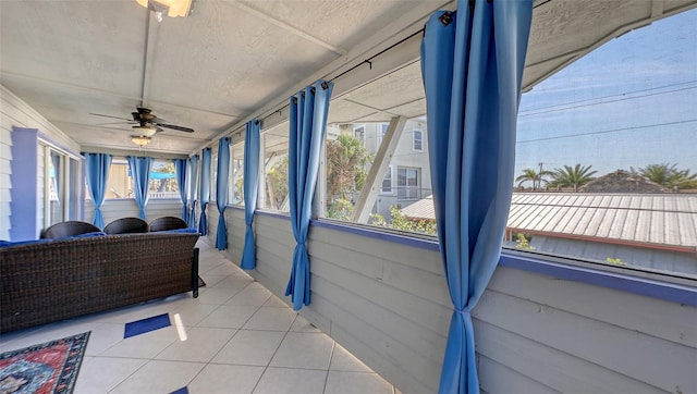 sunroom / solarium with ceiling fan