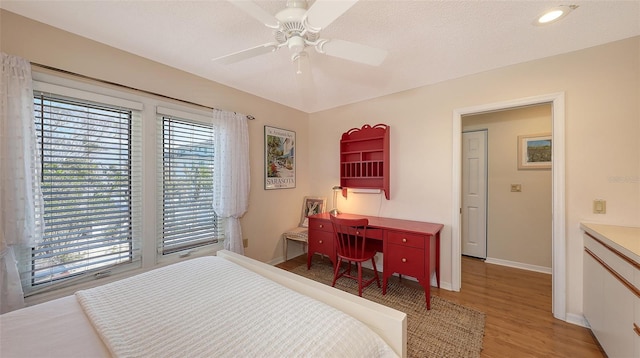 bedroom featuring hardwood / wood-style floors and ceiling fan