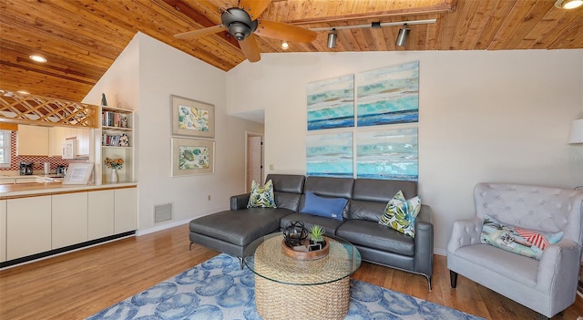 living room with ceiling fan, high vaulted ceiling, track lighting, wooden ceiling, and light wood-type flooring