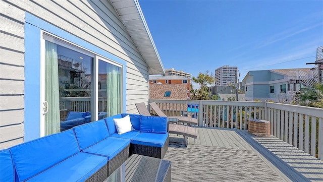 wooden deck featuring outdoor lounge area