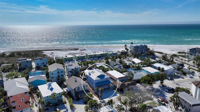 birds eye view of property with a view of the beach and a water view