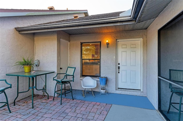 doorway to property featuring a patio area