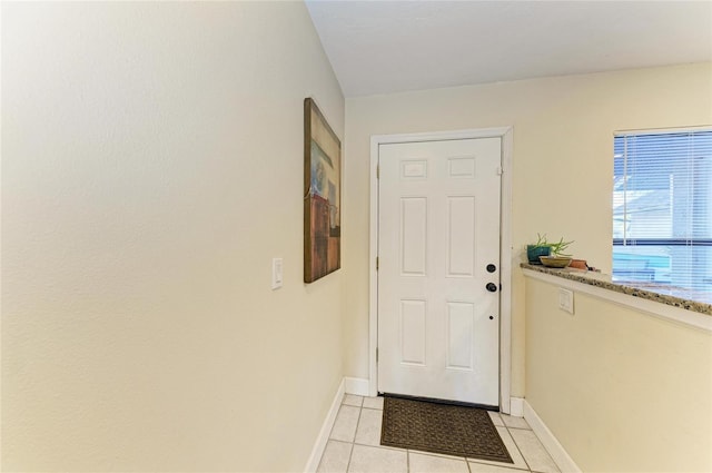 entryway with light tile patterned floors