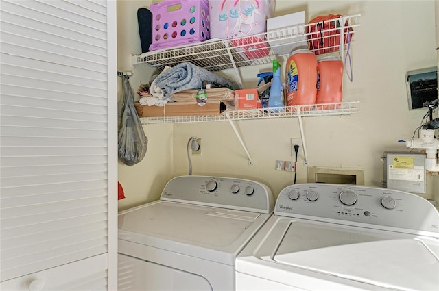 clothes washing area featuring washing machine and clothes dryer