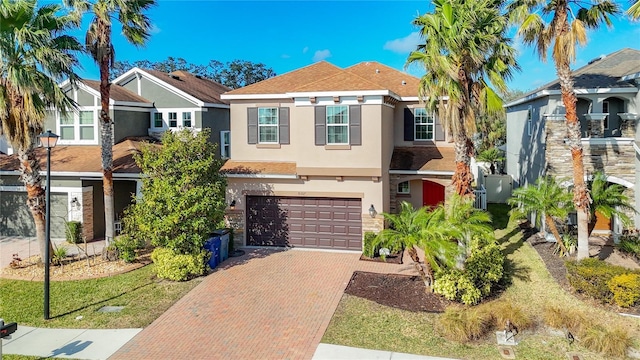 view of front of property with a garage and a front yard