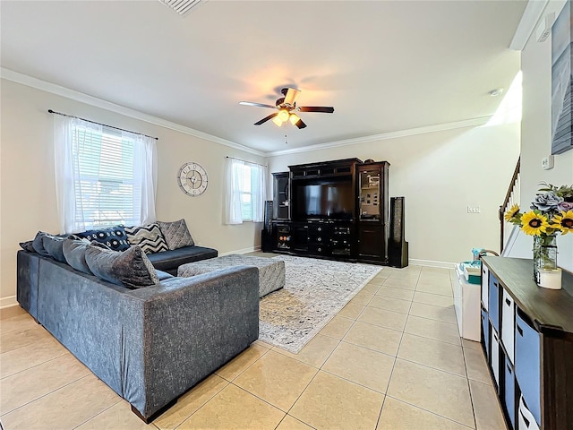 living room with ceiling fan, ornamental molding, and light tile patterned floors