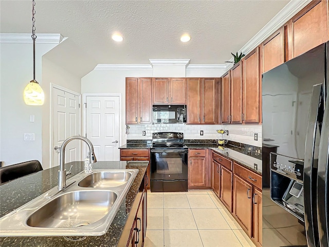 kitchen with light tile patterned floors, sink, hanging light fixtures, backsplash, and black appliances