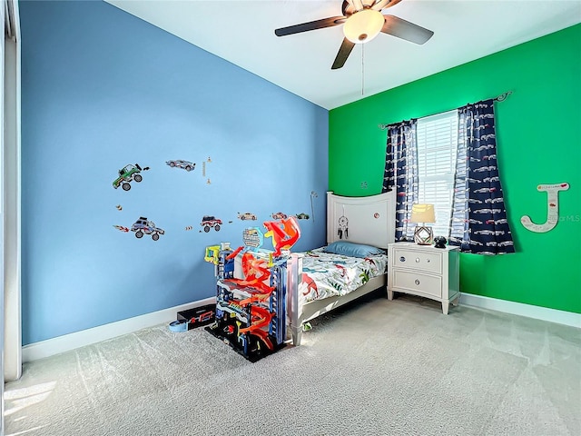 bedroom featuring ceiling fan and carpet