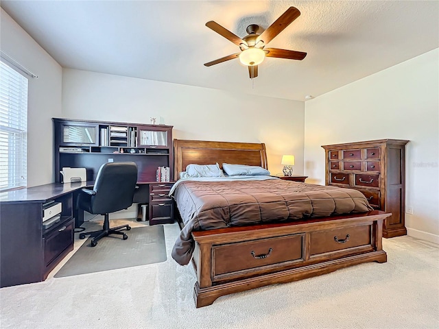 bedroom featuring light carpet and ceiling fan