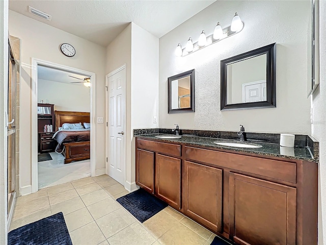 bathroom with ceiling fan, vanity, and tile patterned flooring