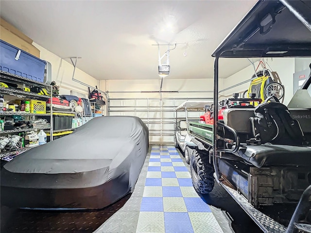 garage featuring a garage door opener