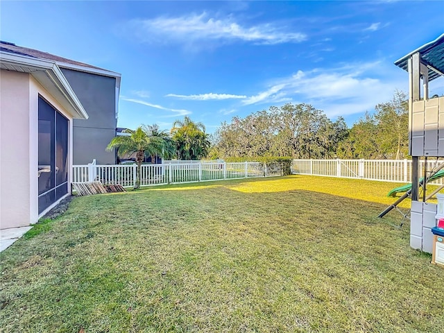 view of yard featuring a sunroom