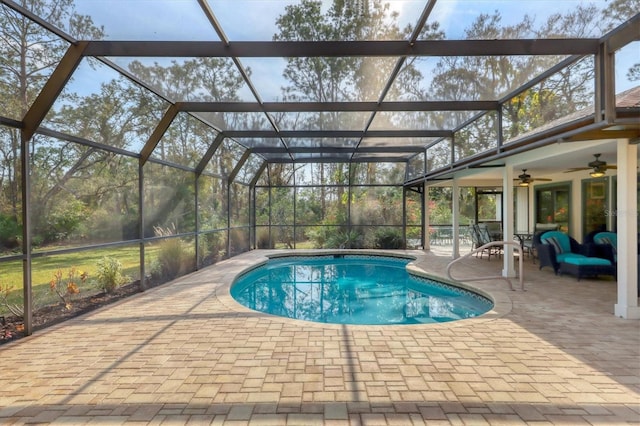 pool with ceiling fan, a patio, and a lanai