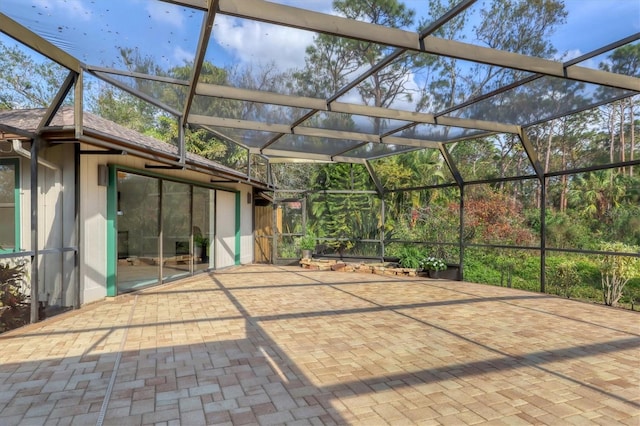 view of patio / terrace featuring glass enclosure