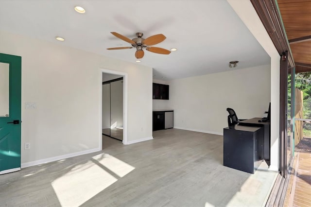 interior space featuring light hardwood / wood-style floors and ceiling fan