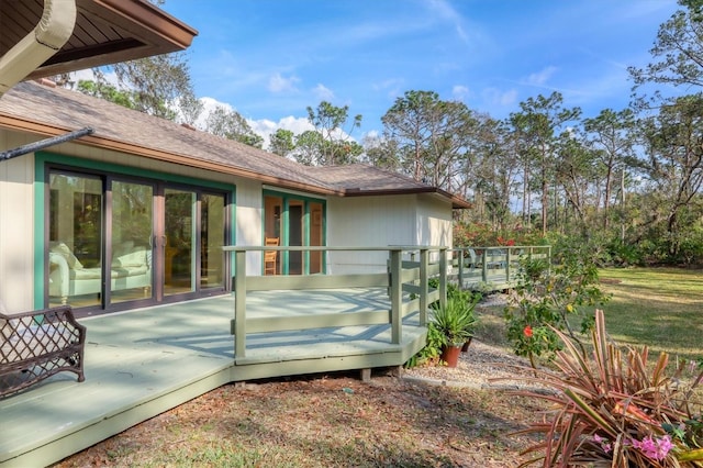 view of home's exterior with a wooden deck