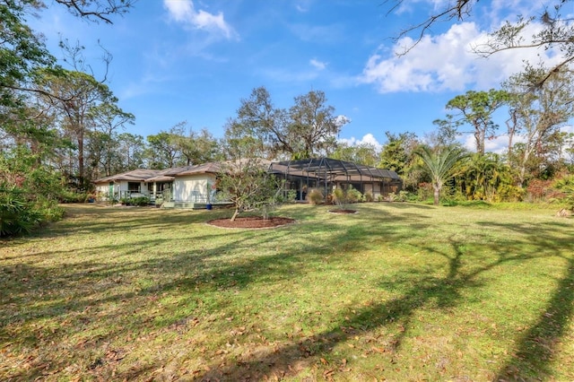 view of yard with a lanai