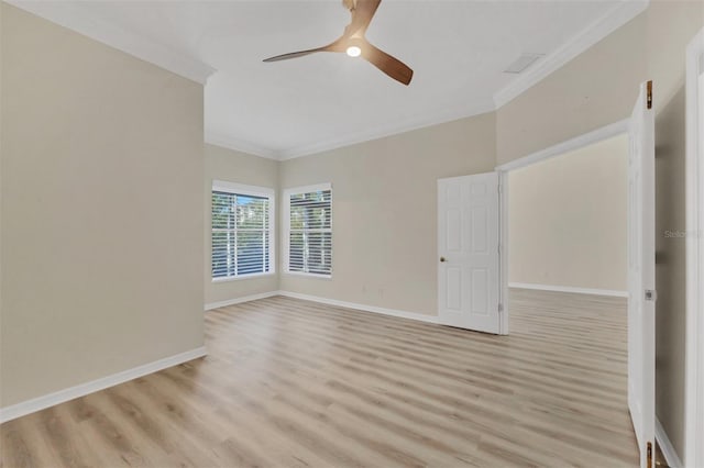 empty room with ceiling fan, ornamental molding, and light hardwood / wood-style floors