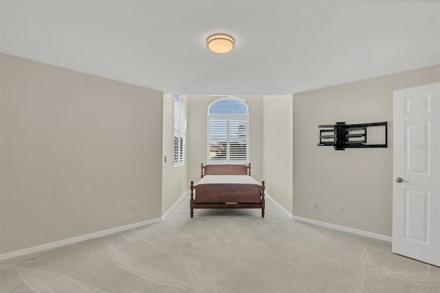 unfurnished room with light carpet