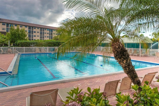 view of pool featuring a patio area