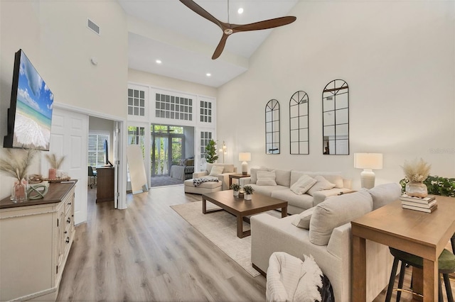 1719 Starling Dr Unit 1719, Sarasota, FL 34231 - living room with a high ceiling, ceiling fan, light wood-style floors, and recessed lighting